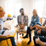 a group of people sitting in chairs in a talking